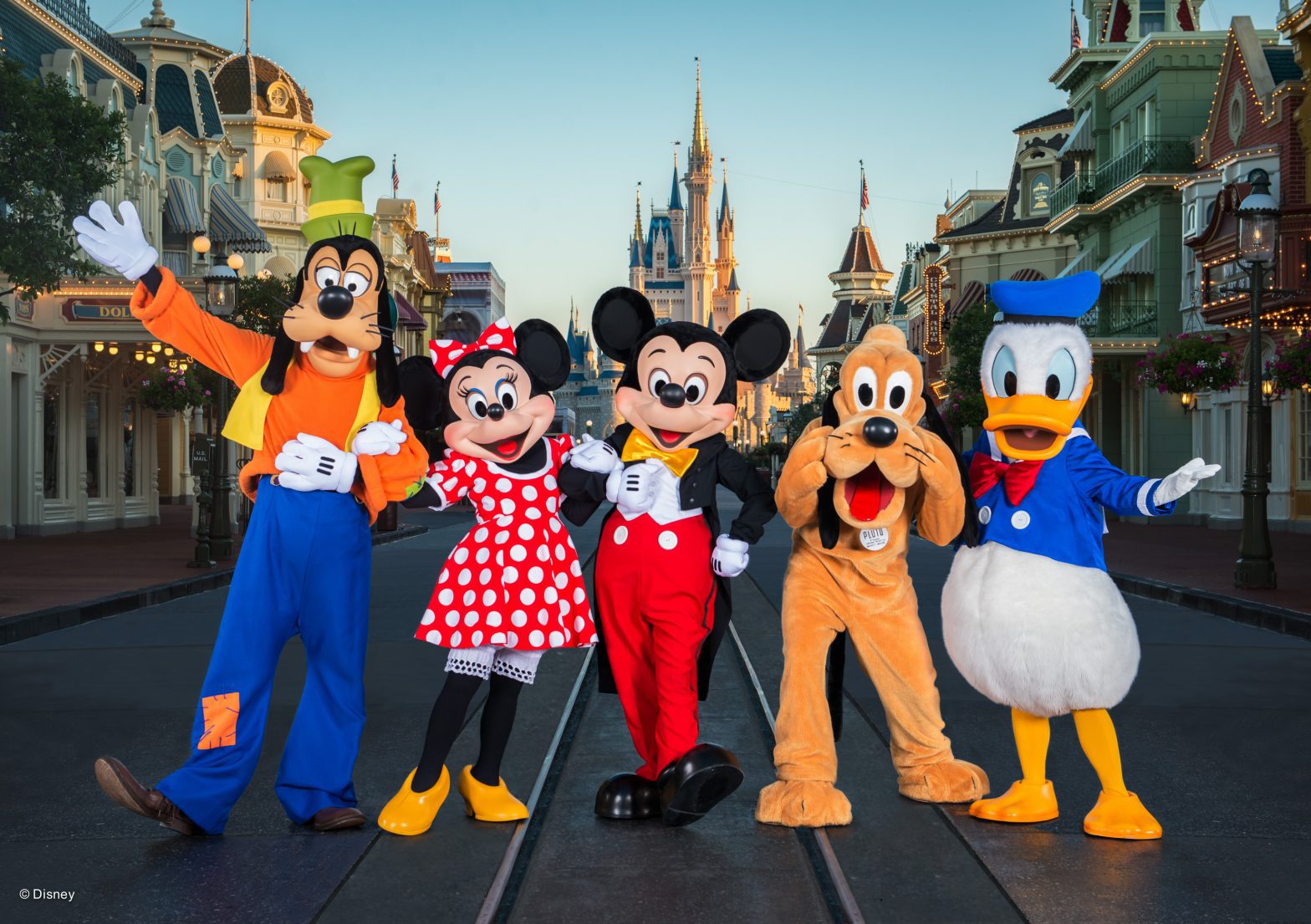 Disney characters in front of Disney Castle- holiday deals- walt disney world resort