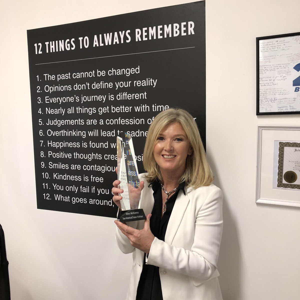  Mary Mckenna posing with the award received